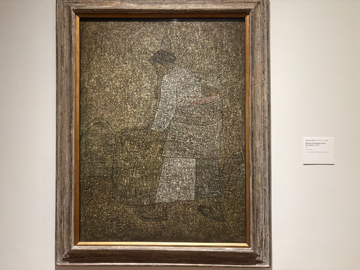 Woman Pounding Grain